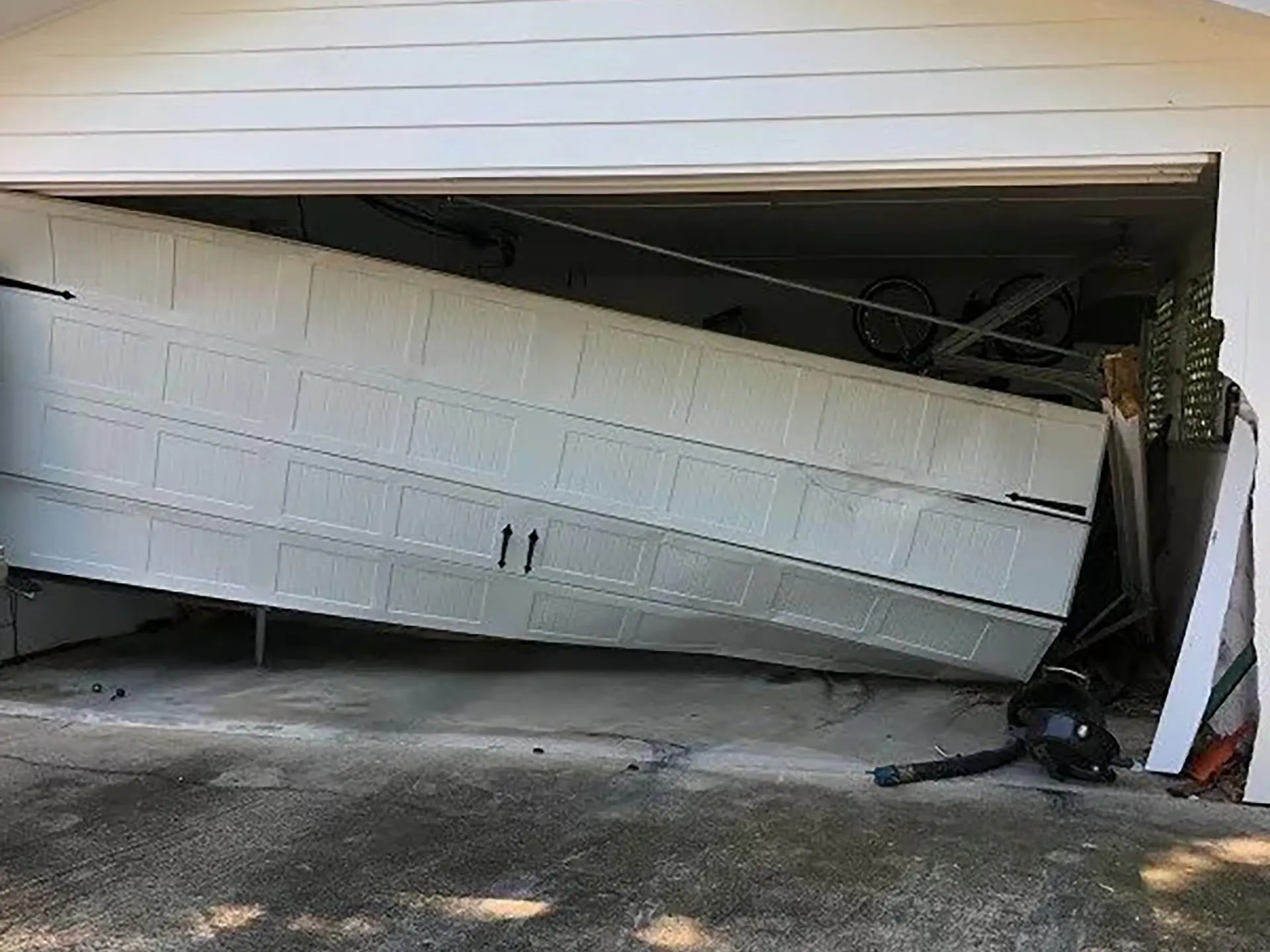 Broken garage door off track